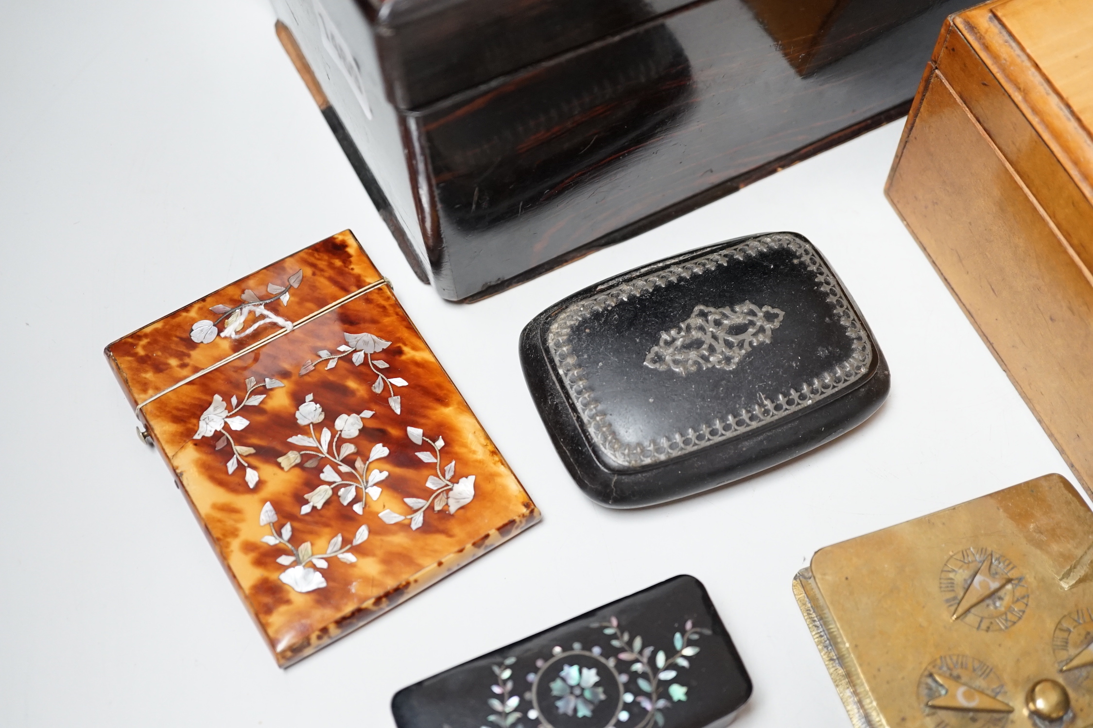 A Victorian Coromandel box containing a Victorian tortoiseshell mother-of-pearl inlaid card case, a Mauchline ware box and other boxes
